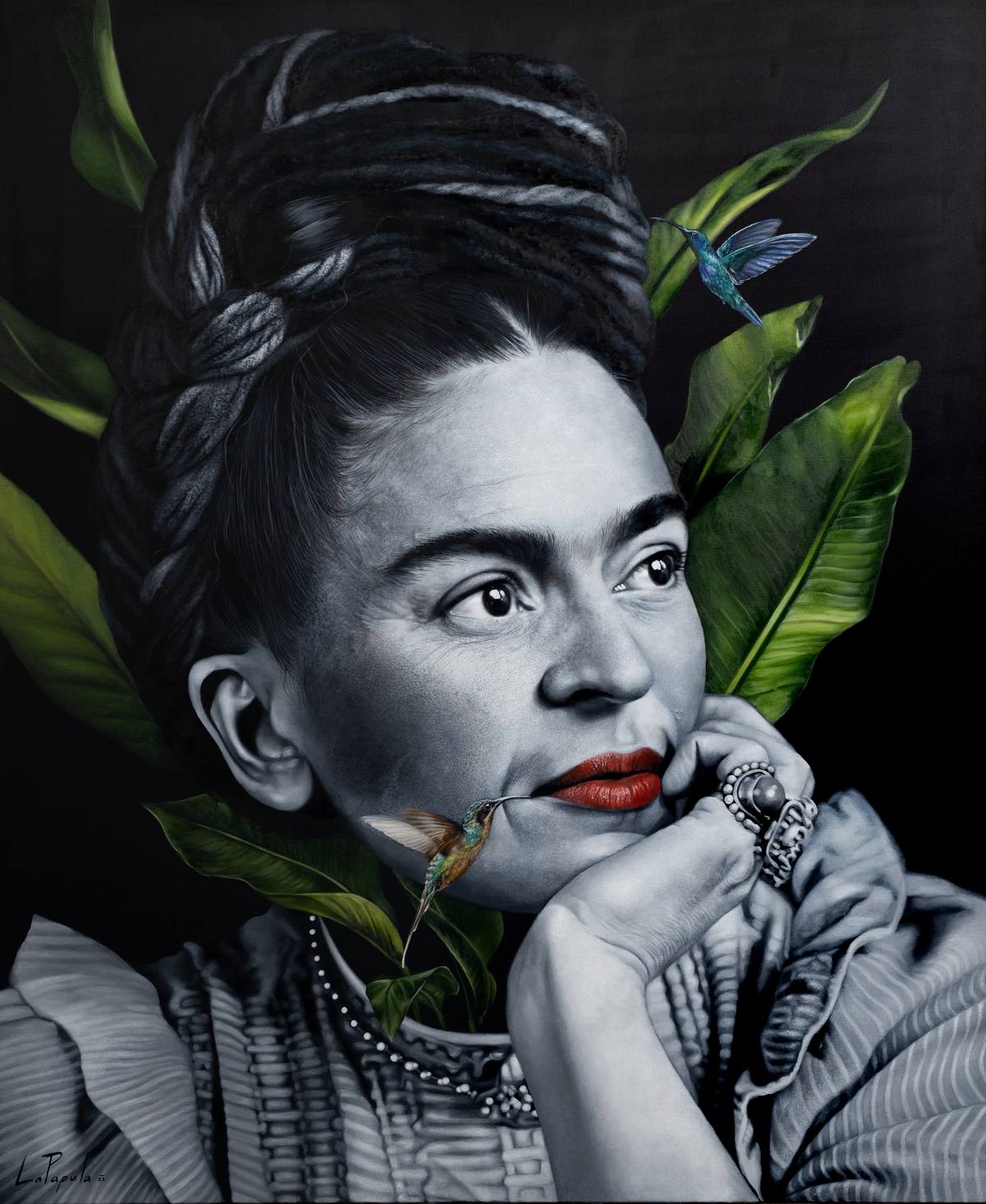 Black and white realistic portrait of a woman with braided hair, her hand resting at her chin and red lips, among green leaves and two hummingbirds.